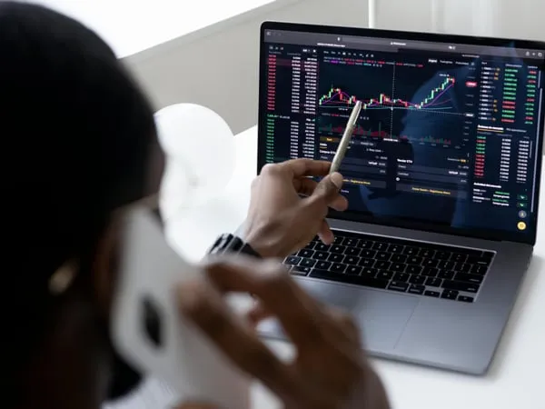 Trader analyzing suspicious activity on screen